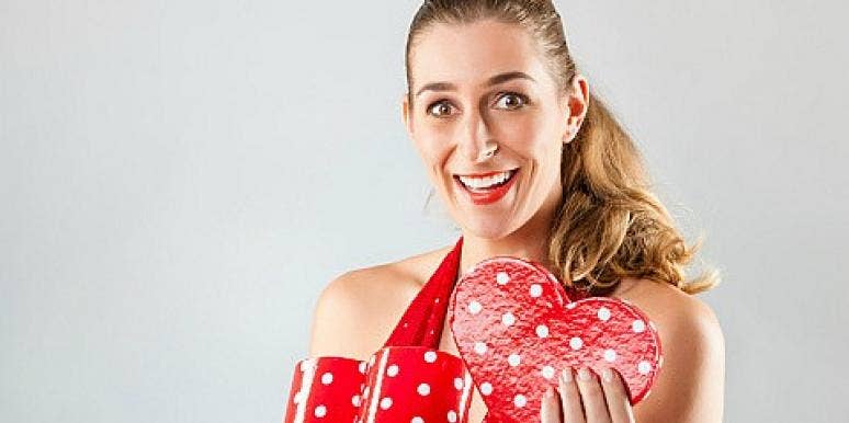 woman opening valentine's day gift woman opening valentine's day gift