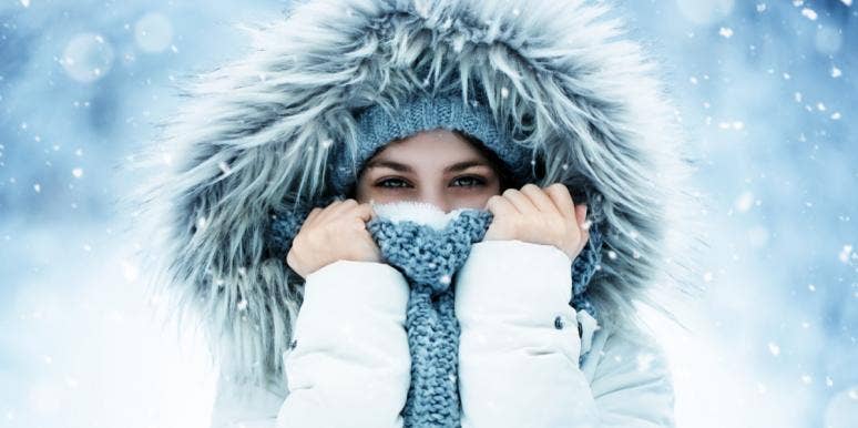 I Don't Look Anything Like My Name, But Is That Really A Problem? woman stands in the snow wearing a fur hood and covering her face