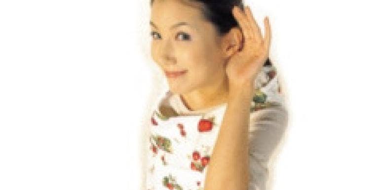 5 Things Single Women Love To Hear woman with hand to ear smiling