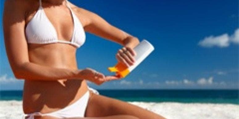 5 Ways To Get The Glowing Skin Men Love woman bikini applying lotion beach