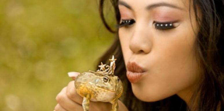 woman kissing frog