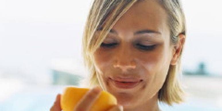 How To Make Guys Want You woman eating an orange