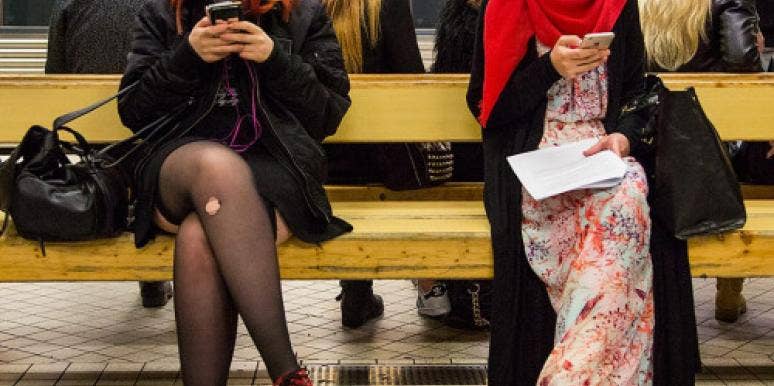 Two very different women texting. Two very different women texting.