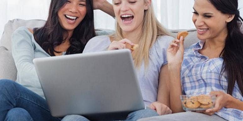 women laughing at laptop women laughing at laptop
