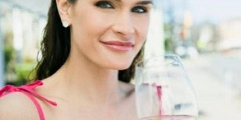 woman drinking white wine