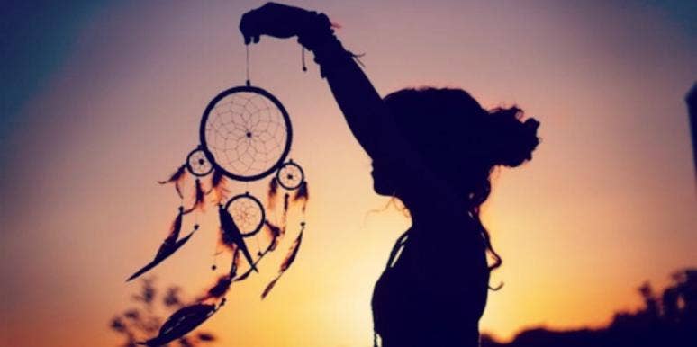 girl holding dreamcatcher girl holding dreamcatcher