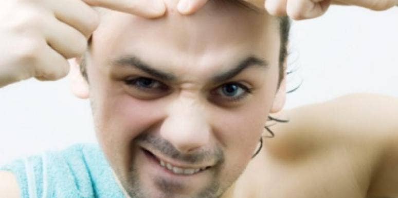 guy poping a zit pop zit blemish pimple squeeze towel