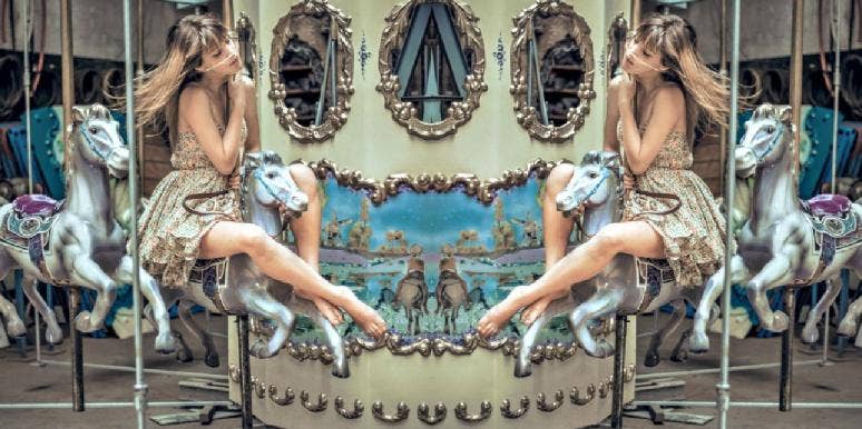 Zodiac Cusp Signs & Dates: What It Means To Be Born On A Cusp girl riding on a merry-go-round