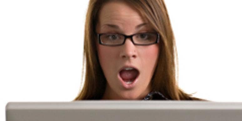 shocked woman looking at computer