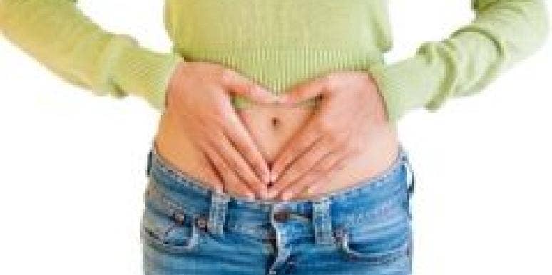 Dating Disaster: A Guy, A Girl, Her Gas woman holding her stomach