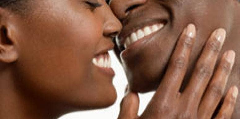 close up of couple smiling about to kiss