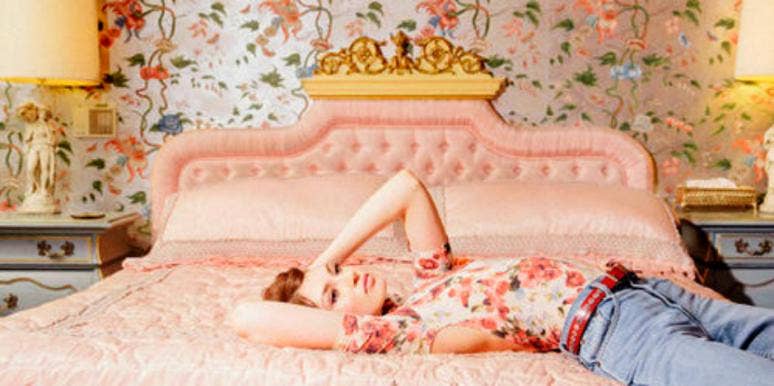 woman laying on bed woman laying on bed