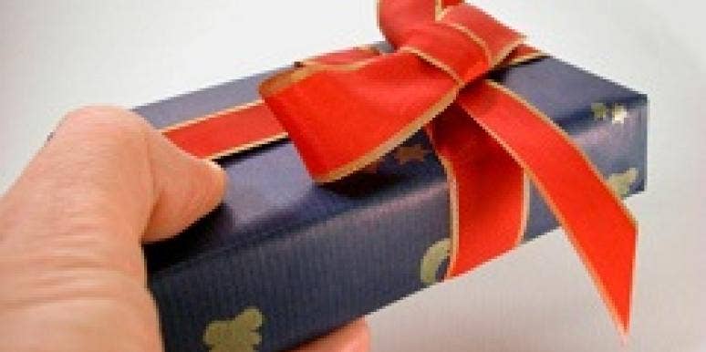 Gifts You Should Give Your Spouse All Year Long man giving gift