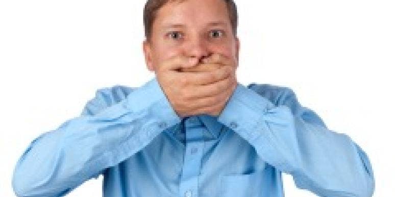 Man with hands over mouth