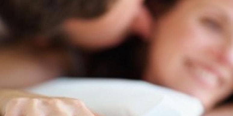 man woman in bed