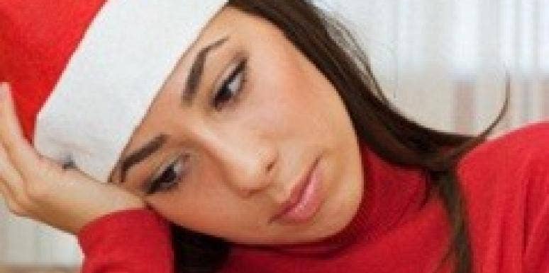 Sad woman in santa hat Sad woman in santa hat