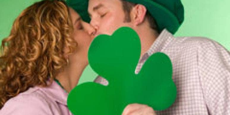 8 Last-Minute St. Patrick's Day Date Ideas Couple kissing on St. Patrick's Day