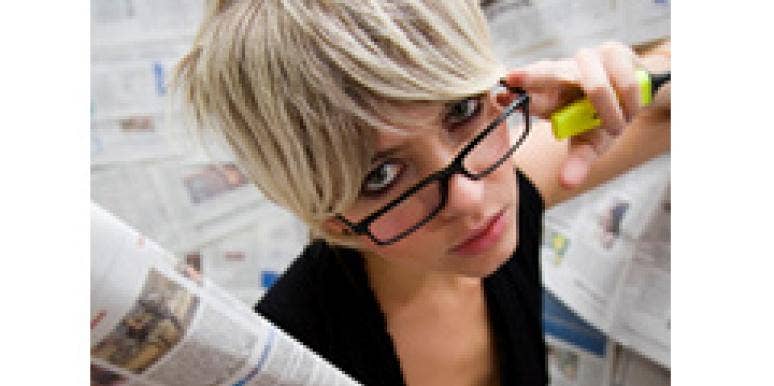 27 Strangest Love & Sex Stories of 2010 woman with newspapers