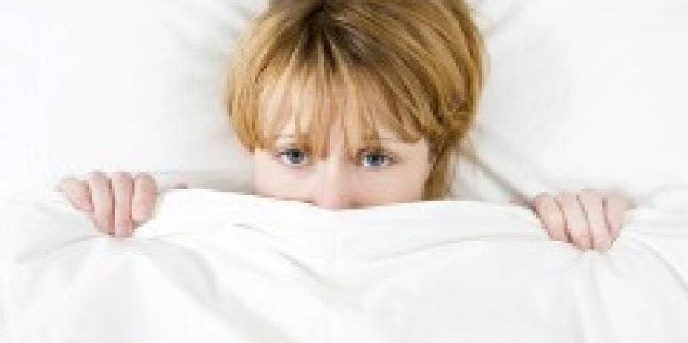 Woman under the covers