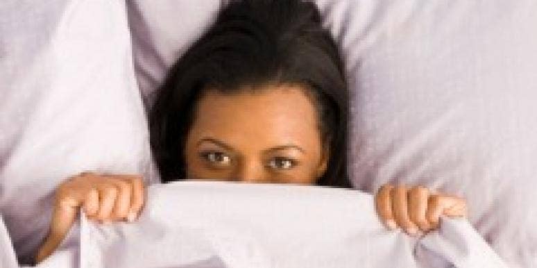 woman hiding under the covers after sex feel shame