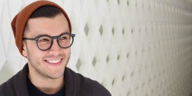 man in glasses smiling