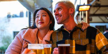 man and woman drinking beer