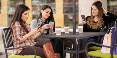 group of friends on their phones