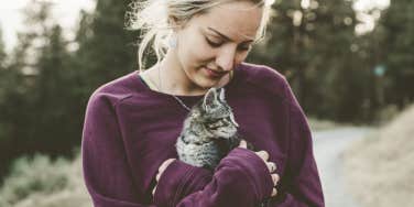 woman holding a kitten 