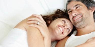 happy couple lying in bed