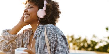 Woman smiling listening to music 