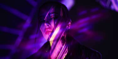 woman in purple dark light