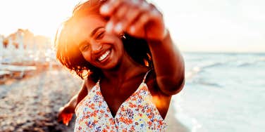 smiling happy woman at the beach
