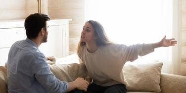 Couple on couch fighting