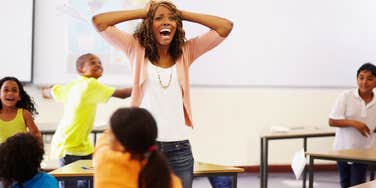 teacher overwhelmed by disorderly classroom