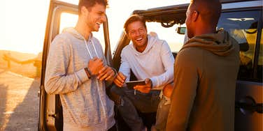 group of men standing together having fun