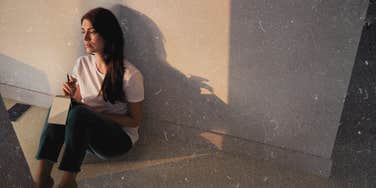 Woman sitting alone in her house