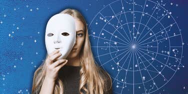 hiding woman on zodiac background