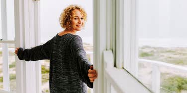 Thankful woman embracing her new freedom, after husband left her for another woman