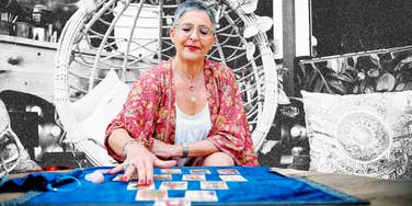 Woman teaching how to read tarot cards
