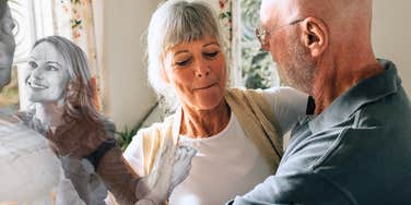 Love transforming over time, couple dancing in kitchens years apart 