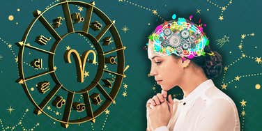 woman thinking next to zodiac sign wheel
