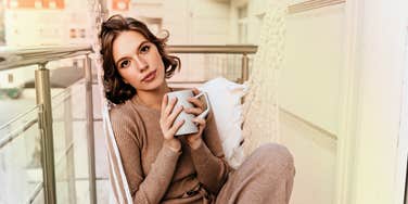 Woman starting her day with gratitude, to attract love