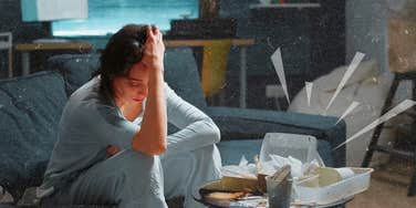 Depressed woman sitting on couch eating junk food
