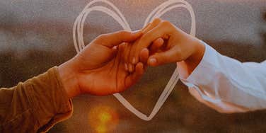 Hopelessly romantic couple holding hands
