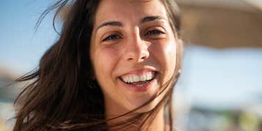mentally strong woman smiling big