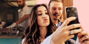 Modern relationship advice when you're falling in love, couple taking selfie together