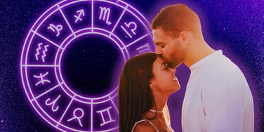 couple in love with zodiac wheel on background