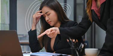 Woman has a silent bully at work.