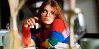 Woman dining alone, not attracting quality partners with online dating