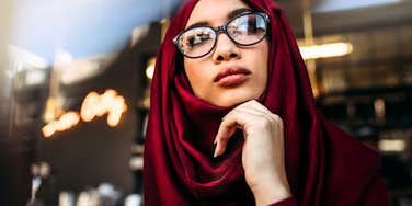 Woman thinking about scheduling a couples therapy session.